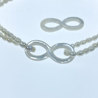 Alternative view of 2pc 9mm x 22mm Organic Hand Carved White Mother of Pearl Infinity Knot Connectors WM-0166